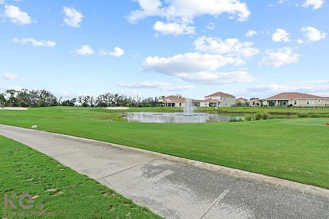 9075 Dogleg Dr, Davenport, FL 33896 - view of property's community with a water view and a yard