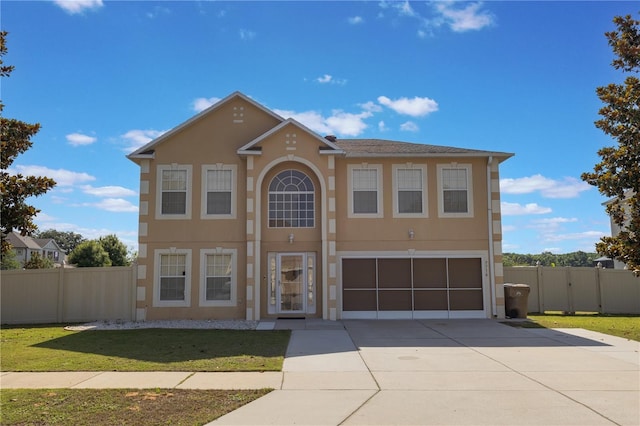 7716 Park Hill Ave, Leesburg, FL 34748 - view of front of house with a garage, stucco siding, and driveway
