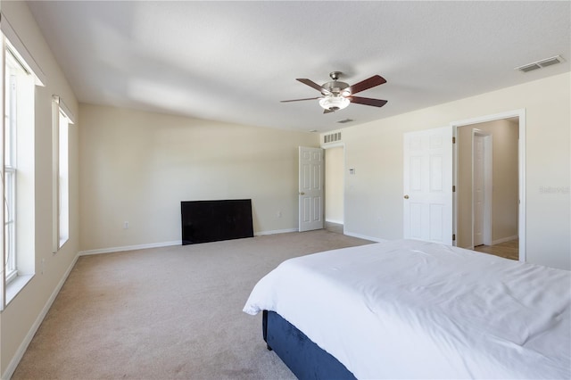 7716 Park Hill Ave, Leesburg, FL 34748 - bedroom featuring light carpet, a ceiling fan, and baseboards