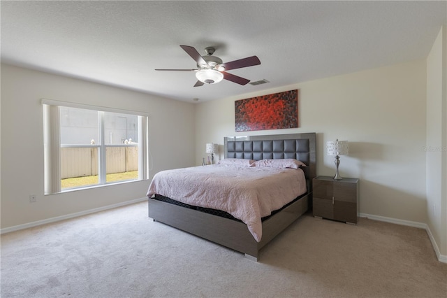 7716 Park Hill Ave, Leesburg, FL 34748 - carpeted bedroom with baseboards and ceiling fan