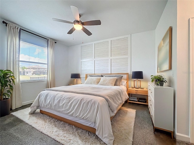195 Preston Ave, Davenport, FL 33837 - bedroom featuring ceiling fan, dark carpet, and baseboards