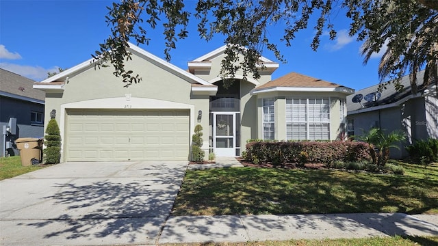 ranch-style home featuring a front lawn, driveway, stucco siding, and an attached garage