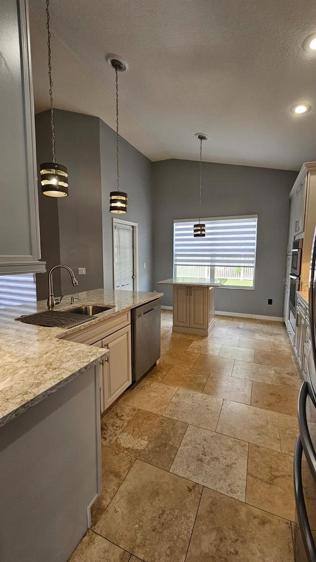 kitchen with baseboards, a textured ceiling, hanging light fixtures, a sink, and appliances with stainless steel finishes