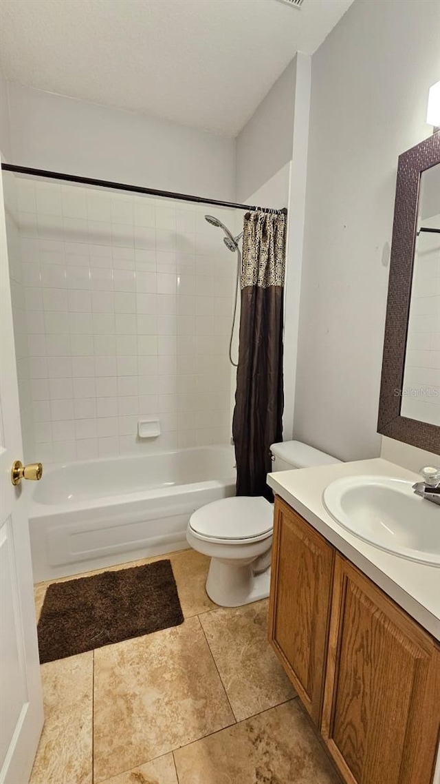 full bath with toilet, shower / tub combo with curtain, vanity, and tile patterned flooring