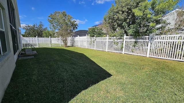 view of yard with a fenced backyard