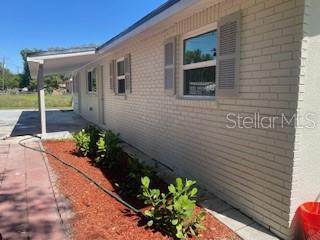 3135 Old Dixie Hwy, Auburndale, FL 33823 - view of side of home featuring brick siding
