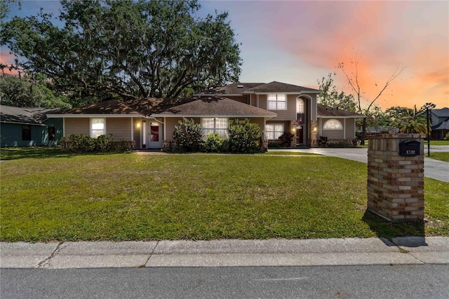1730 King Henry Dr, Kissimmee, FL 34744 - view of front of house with driveway and a front yard