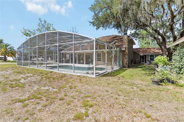1730 King Henry Dr, Kissimmee, FL 34744 - exterior space featuring a lanai and a lawn