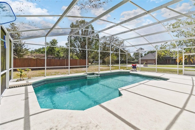 1730 King Henry Dr, Kissimmee, FL 34744 - view of pool featuring glass enclosure, fence, a fenced in pool, and a patio area