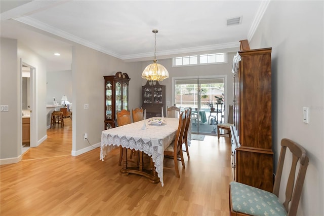 1730 King Henry Dr, Kissimmee, FL 34744 - dining room featuring baseboards, visible vents, light wood-style floors, and a chandelier