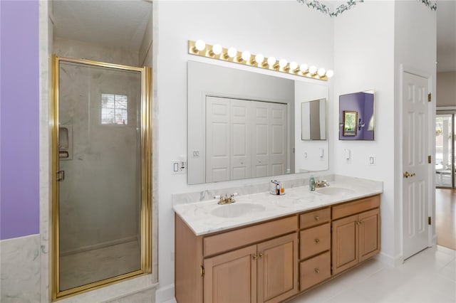 1730 King Henry Dr, Kissimmee, FL 34744 - full bath featuring a stall shower, double vanity, a sink, and tile patterned floors