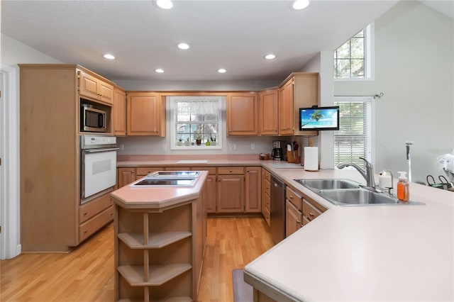 1730 King Henry Dr, Kissimmee, FL 34744 - kitchen featuring a sink, appliances with stainless steel finishes, open shelves, and light brown cabinetry