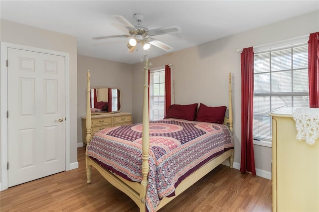 1730 King Henry Dr, Kissimmee, FL 34744 - bedroom with baseboards, ceiling fan, and light wood-style floors