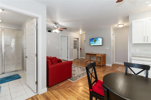 1730 King Henry Dr, Kissimmee, FL 34744 - dining space featuring baseboards, light wood-style flooring, and a ceiling fan
