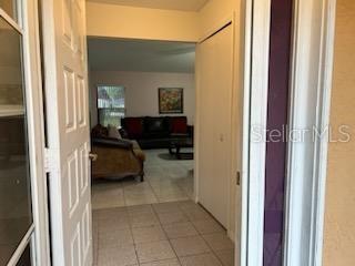 133 Bianca Ct, Kissimmee, FL 34758 - corridor featuring light tile patterned floors