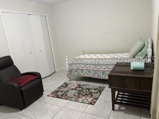 133 Bianca Ct, Kissimmee, FL 34758 - bedroom featuring tile patterned floors and a closet