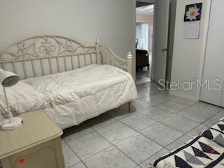 133 Bianca Ct, Kissimmee, FL 34758 - bedroom with light tile patterned floors