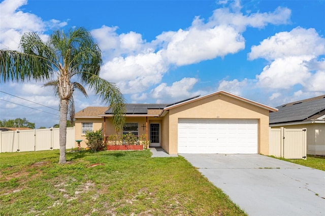 101 Cheltenham Pl, Kissimmee, FL 34758 - single story home featuring stucco siding, a gate, a front lawn, a garage, and roof mounted solar panels