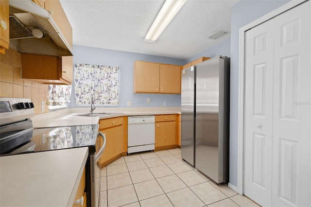 101 Cheltenham Pl, Kissimmee, FL 34758 - kitchen with under cabinet range hood, light countertops, visible vents, and appliances with stainless steel finishes