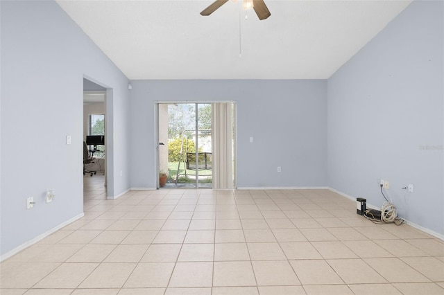 101 Cheltenham Pl, Kissimmee, FL 34758 - spare room with light tile patterned flooring, lofted ceiling, ceiling fan, and baseboards