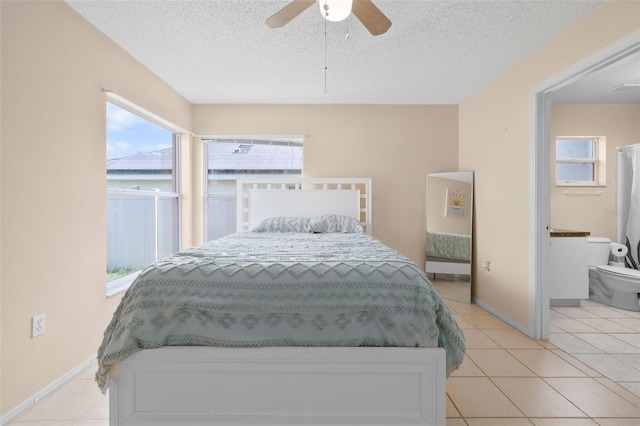 101 Cheltenham Pl, Kissimmee, FL 34758 - bedroom featuring light tile patterned flooring, a textured ceiling, and multiple windows