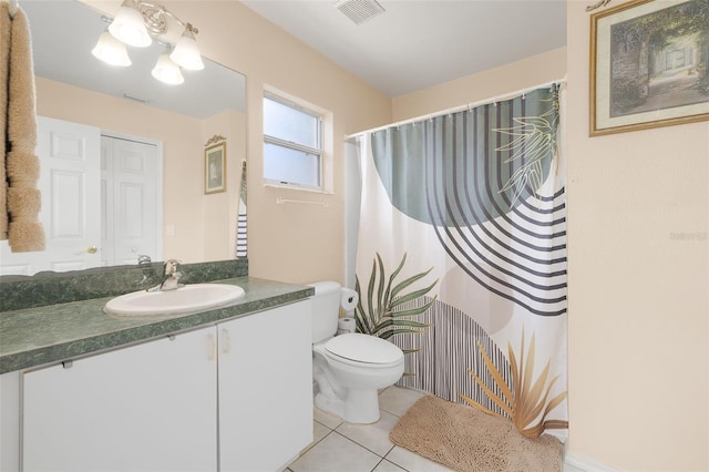 101 Cheltenham Pl, Kissimmee, FL 34758 - bathroom with visible vents, a shower with shower curtain, toilet, tile patterned floors, and vanity