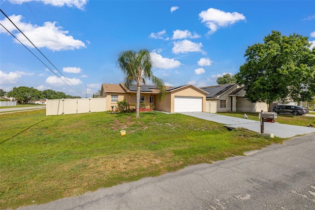 101 Cheltenham Pl, Kissimmee, FL 34758 - single story home with driveway, fence, a front lawn, roof mounted solar panels, and a garage