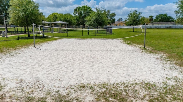 101 Cheltenham Pl, Kissimmee, FL 34758 - view of home's community with a lawn, fence, and volleyball court