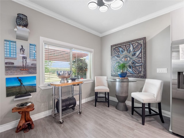 1911 Greenbriar Ter, Davenport, FL 33837 - sitting room with crown molding, baseboards, a chandelier, and wood finished floors