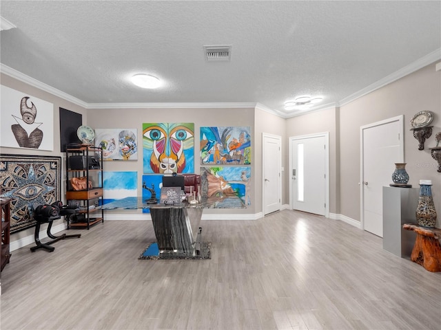 1911 Greenbriar Ter, Davenport, FL 33837 - interior space with baseboards, a textured ceiling, crown molding, visible vents, and wood finished floors