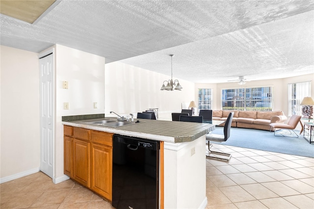 2741 N Poinciana Blvd Unit 49, Kissimmee, FL 34746 - kitchen with a sink, dishwasher, a textured ceiling, open floor plan, and light tile patterned floors
