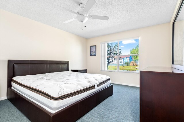 2741 N Poinciana Blvd Unit 49, Kissimmee, FL 34746 - carpeted bedroom with baseboards, a textured ceiling, and ceiling fan