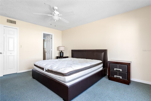 2741 N Poinciana Blvd Unit 49, Kissimmee, FL 34746 - bedroom with baseboards, visible vents, carpet floors, and a textured ceiling