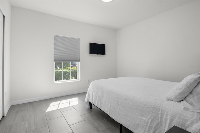 bedroom featuring baseboards