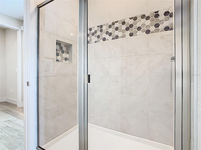 bathroom with a stall shower