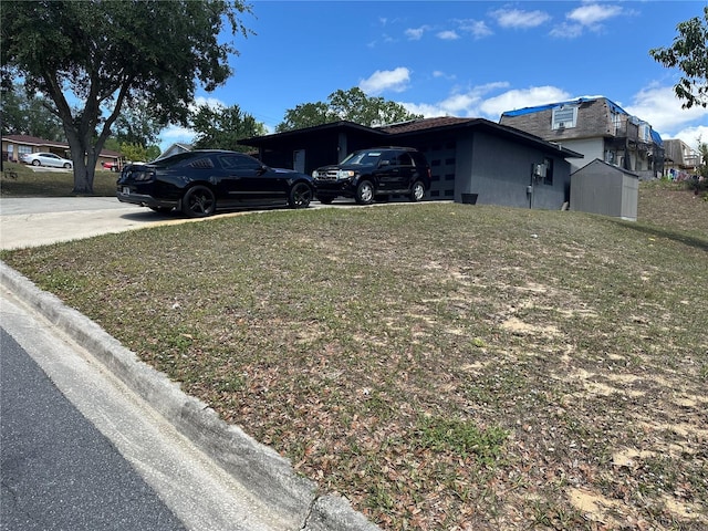 view of property exterior featuring driveway and a yard