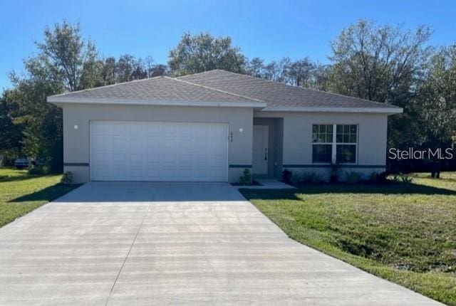 848 San Pedro Ct, Kissimmee, FL 34758 - ranch-style home with roof with shingles, stucco siding, driveway, an attached garage, and a front lawn
