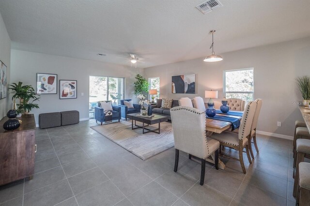848 San Pedro Ct, Kissimmee, FL 34758 - tiled dining space featuring visible vents, baseboards, and a ceiling fan