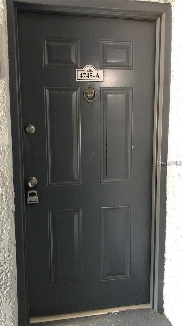 4745 S Texas Ave Unit A, Orlando, FL 32839 - property entrance with stucco siding