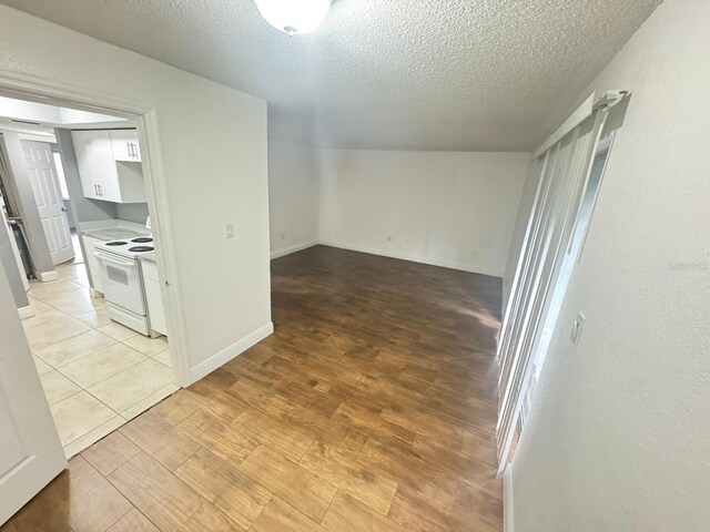 4745 S Texas Ave Unit A, Orlando, FL 32839 - spare room with a textured ceiling and light wood-type flooring