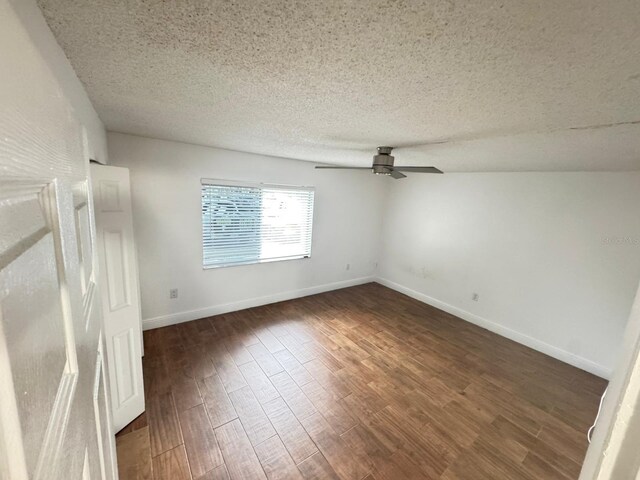 4745 S Texas Ave Unit A, Orlando, FL 32839 - spare room with a ceiling fan, dark wood-type flooring, a textured ceiling, and baseboards