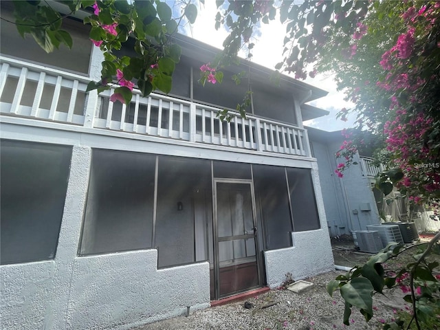 4745 S Texas Ave Unit A, Orlando, FL 32839 - rear view of property featuring a balcony and central air condition unit