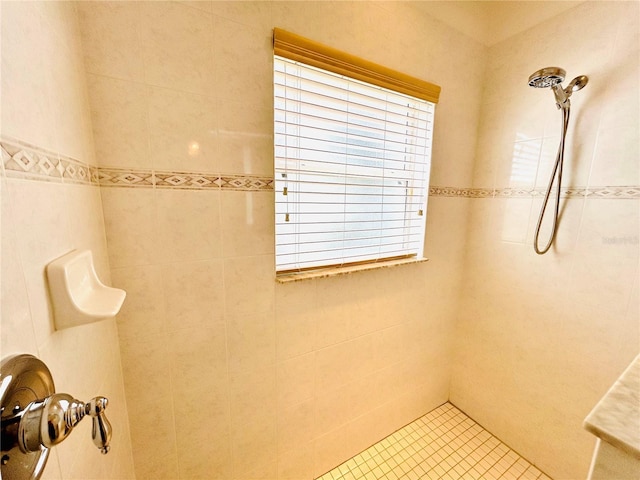 full bath with tiled shower