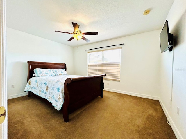 bedroom with carpet flooring, baseboards, and a ceiling fan
