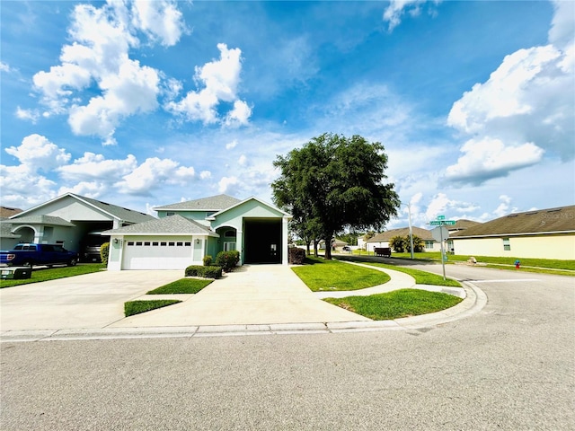 ranch-style home with driveway, a garage, and a front lawn
