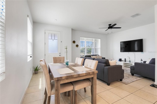 2412 Good Will Aly, Kissimmee, FL 34744 - dining space with light tile patterned floors, visible vents, baseboards, and ceiling fan