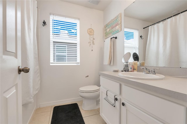 2412 Good Will Aly, Kissimmee, FL 34744 - bathroom featuring toilet, tile patterned floors, vanity, and baseboards