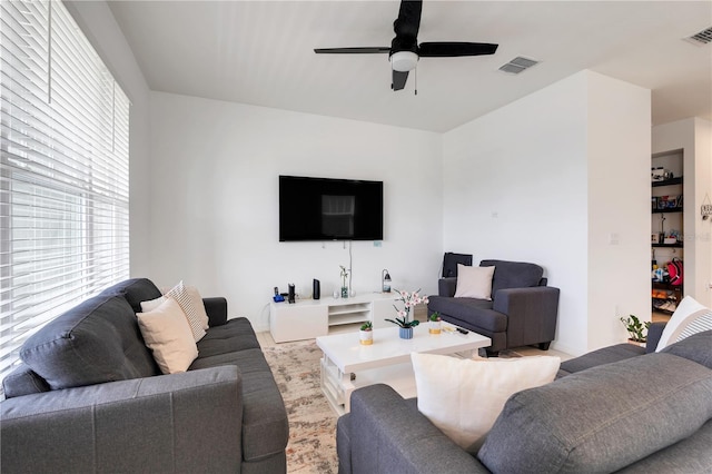 2412 Good Will Aly, Kissimmee, FL 34744 - living room featuring visible vents and a ceiling fan