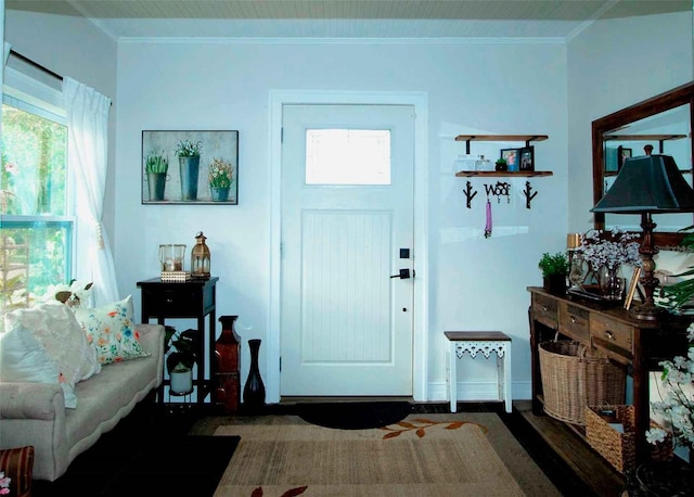 foyer featuring crown molding