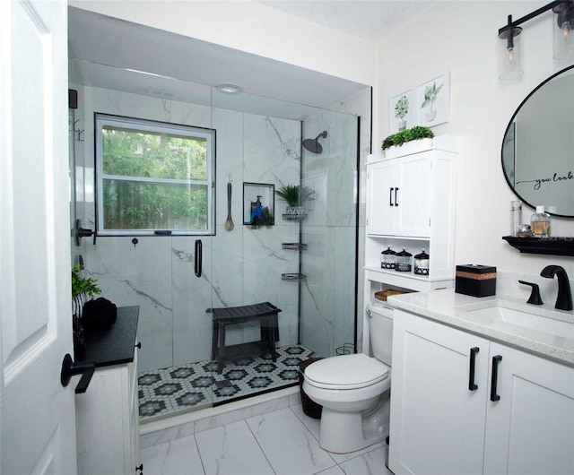 bathroom featuring a marble finish shower, toilet, marble finish floor, and vanity